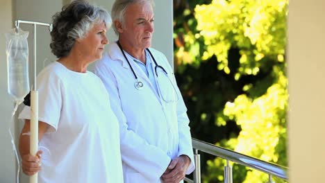 doctor talking with his patient on the deck