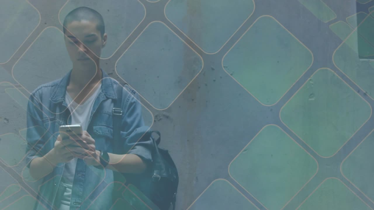 Tech student leaning on wall, framing shifting revealing, scrolling phone checking texts under grid