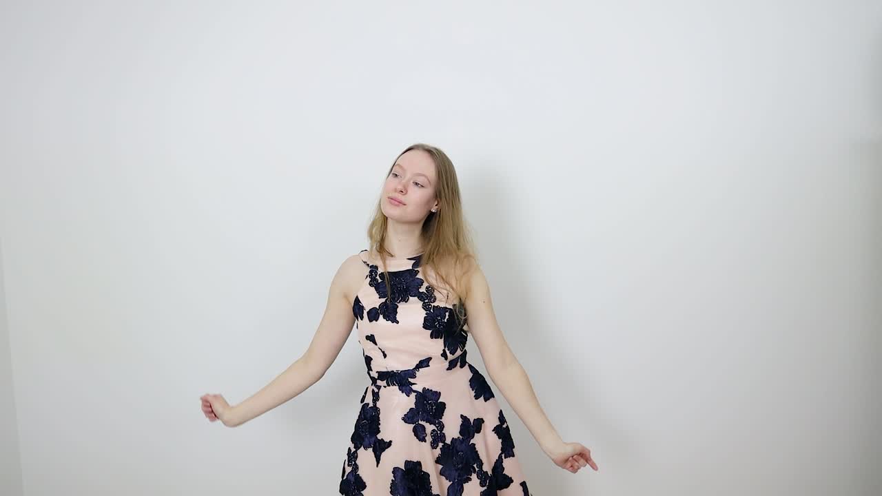 Beautiful Young Woman in Pink Floral Dress