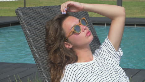 woman relaxing by the pool