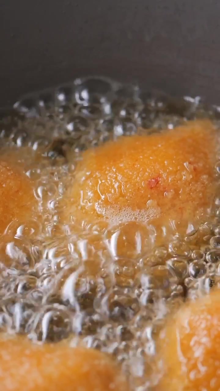 Golden Coxinha Frying in Hot Oil