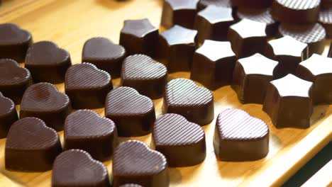 assortment of chocolate candies in heart and star shapes