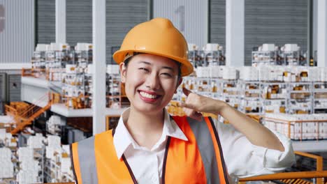 warehouse worker making a phone call gesture