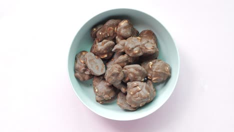chocolate covered peanuts in a bowl