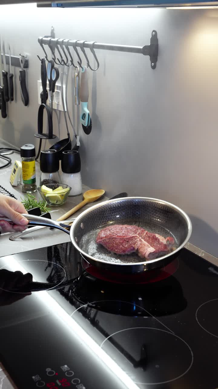 Pan fry cooking ribeye steak meat professional pan carnivore diet meal prep, vertical video