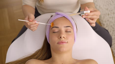 woman receiving facial beauty treatment