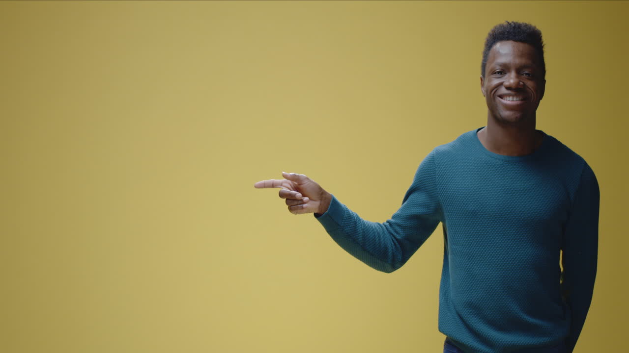 Young Black man pointing to copy space with varying expressions