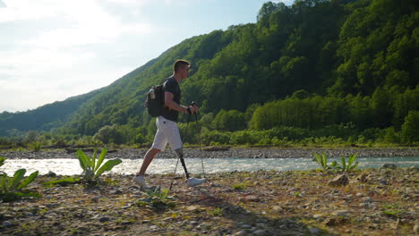 man with prosthetic leg hiking in the mountains