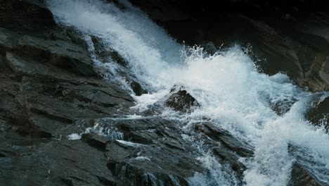 the torrent of the whitewater rushes over the rocks