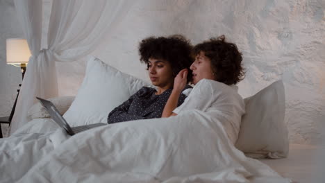 couple watching movie on laptop