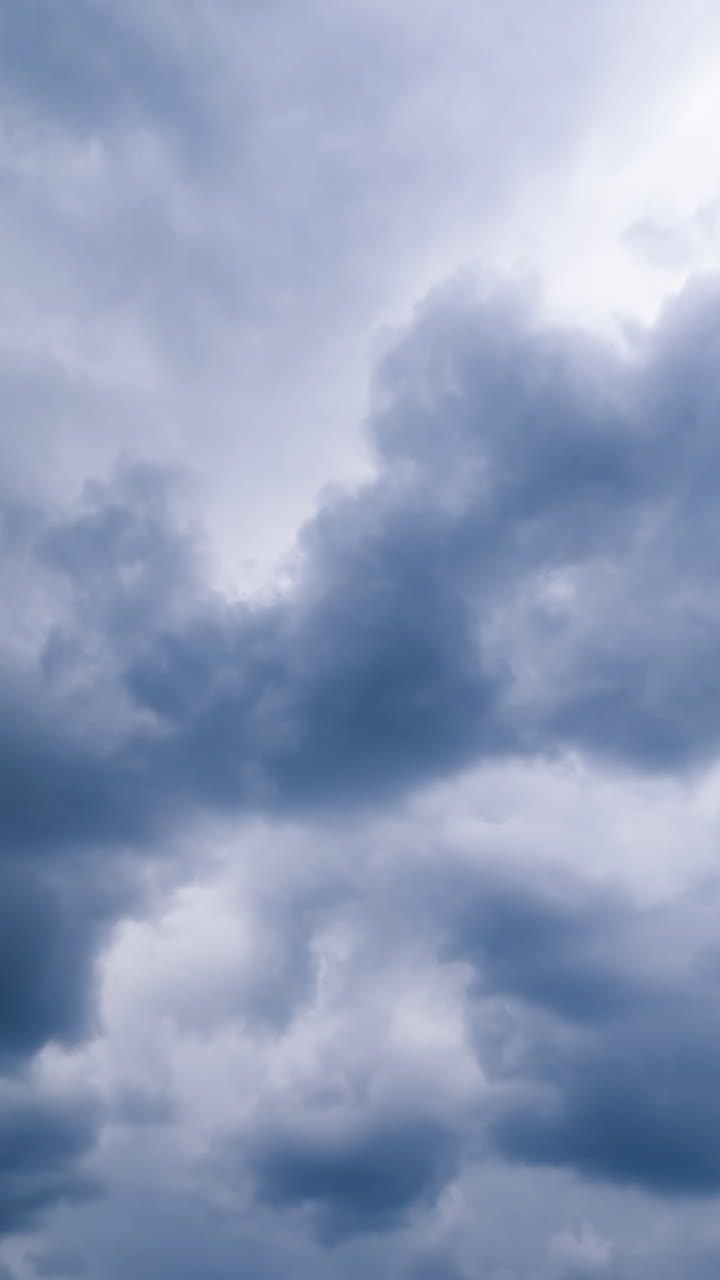 Flowing sunlight scenery sky. Summer blue sky with clouds timelapse. Vertical video