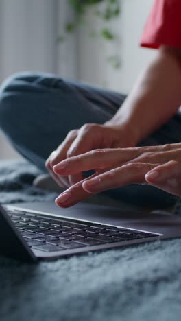 woman working on a laptop at home