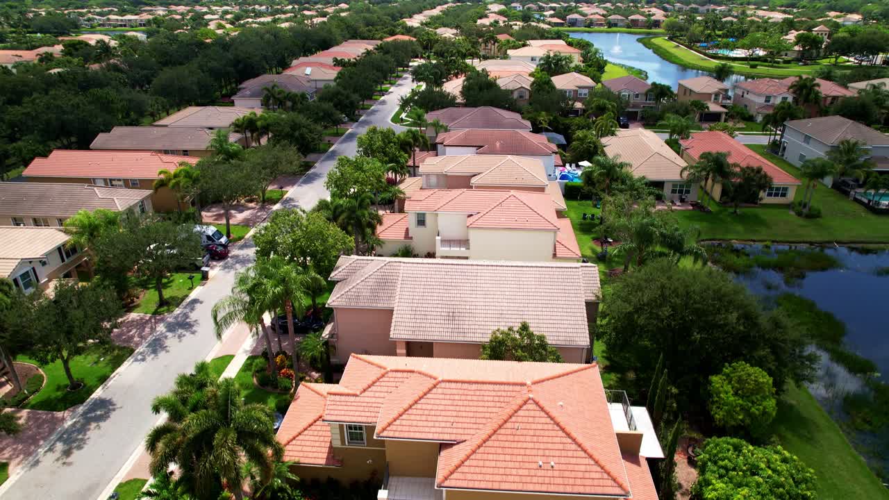 Crane up drone shot of residential area and real estate during the day in West Palm Beach, Florida, USA