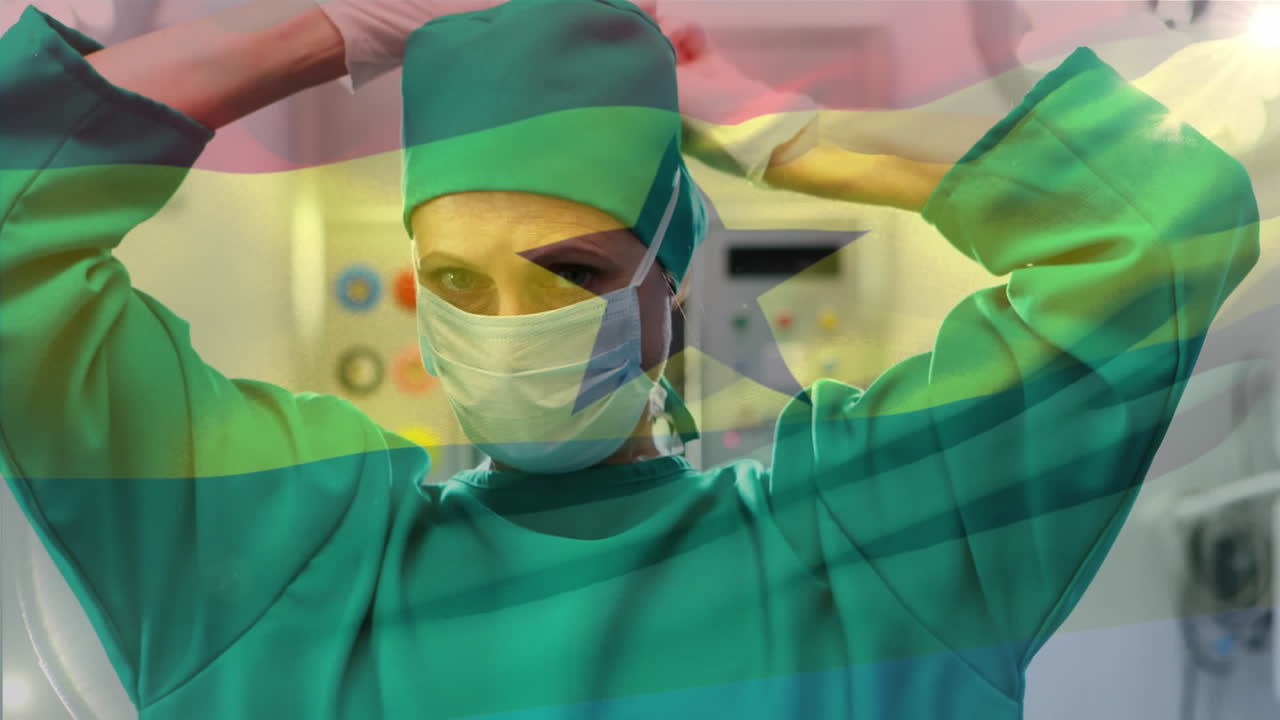 animación de la bandera de ghana ondeando sobre una cirujana en el quirófano