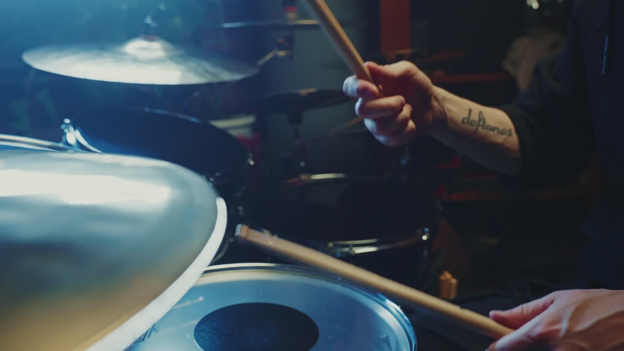 Drummer Playing Drums in a Studio