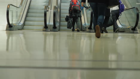 people on an airport escalator 1