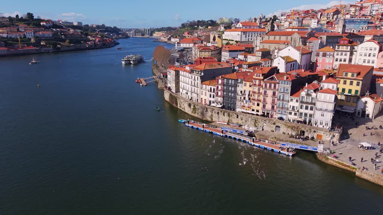 Porto old town colourful medieval buildings down to Douro River, Drone shot