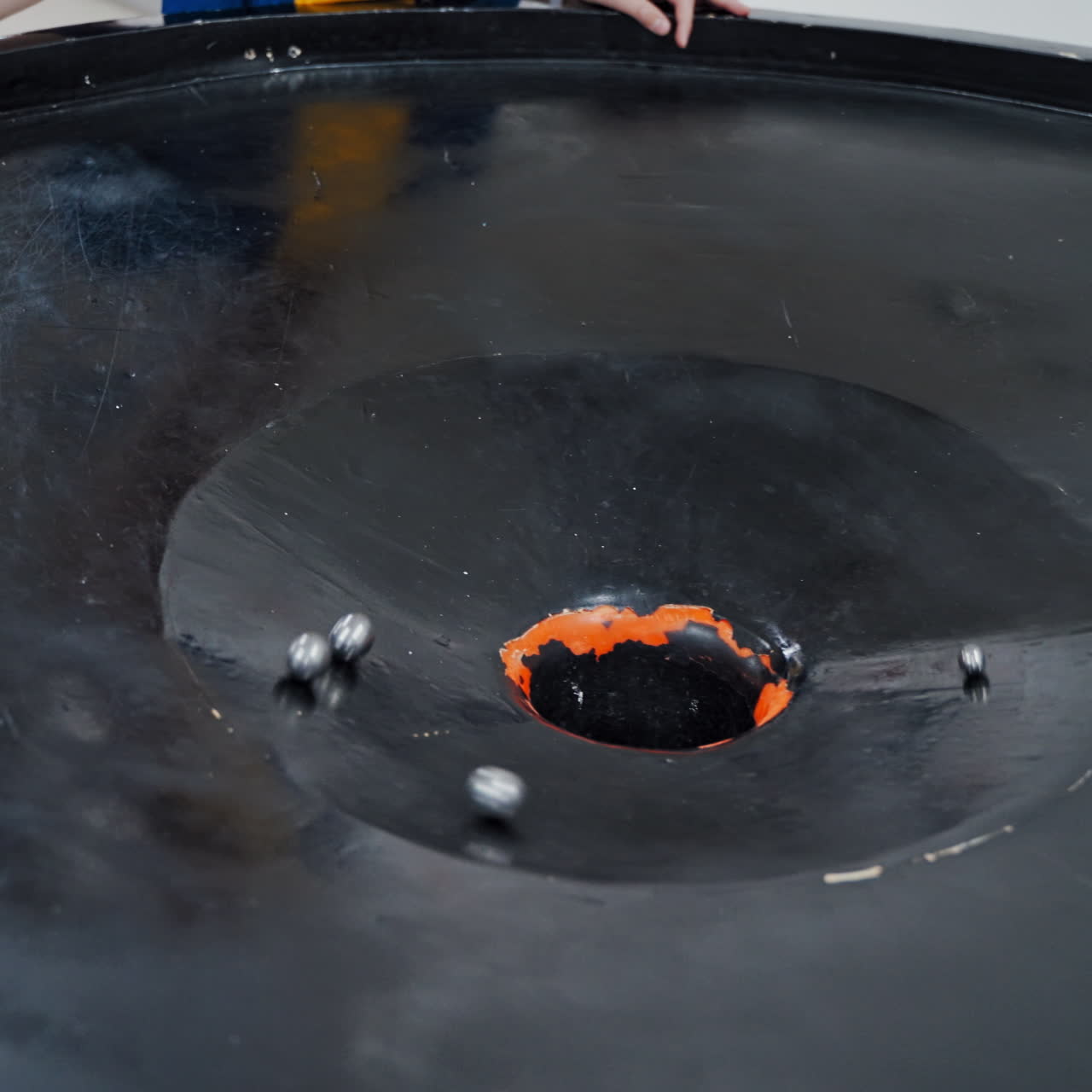 Boy in the museum science. Gravitational field model of black hole