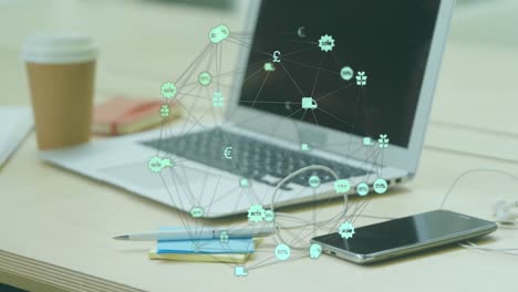 Animación-Del-Globo-De-Iconos-Digitales-Girando-Contra-Equipos-De-Oficina-Sobre-Una-Mesa-De-Madera