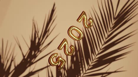 Golden-ballon-2025-on-Silhouetted-Palms-brown-background-vertical