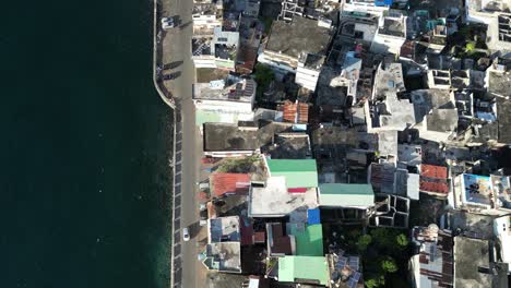 anjouan fisherman town in comoros island archipelago aerial top down of coastline road with car driving