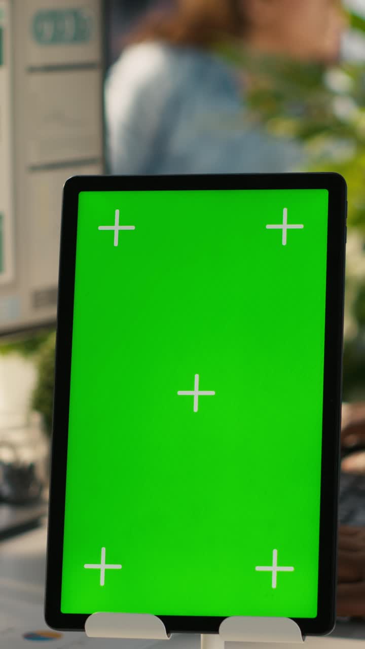 Vertical video Close up of isolated screen tablet used by worker in office