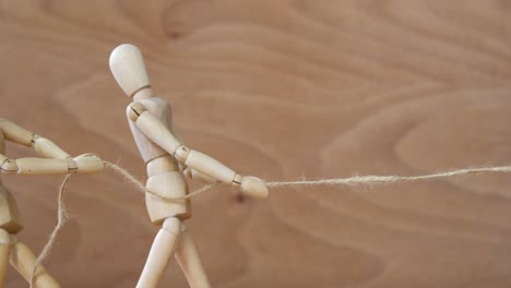 figurine playing tug-of-war