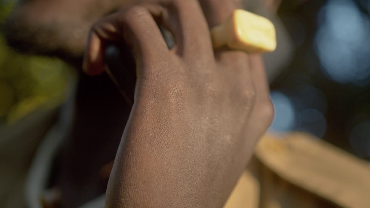 Revealing Shot Of Karamojong Tribal Warrior Smiling While On Phone Call In Africa