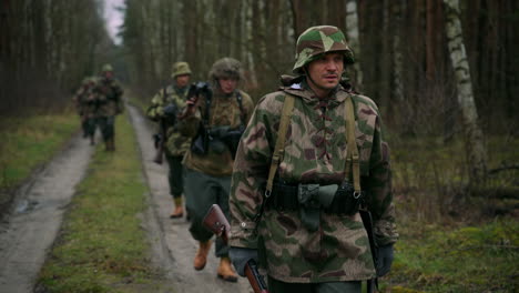 german soldiers marching through forest