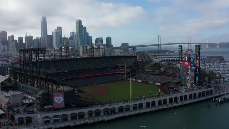 Close-up aerial shot of Oracle Park in San Francisco on a foggy day