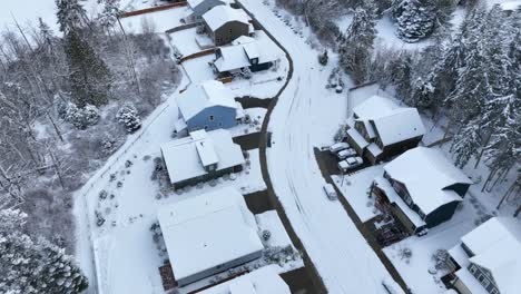 overhead aerial view of houses covered in fresh snow