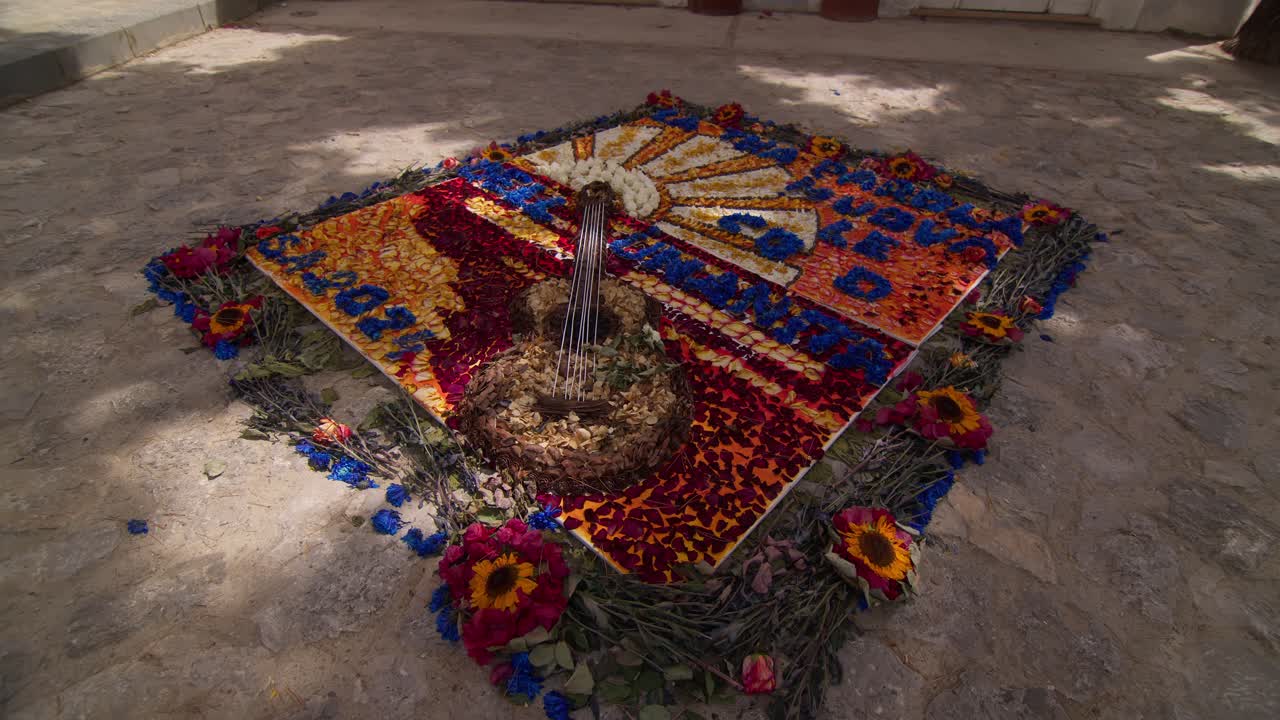 Detailed view of vibrant flower artwork on the ground in Anacapri's main square