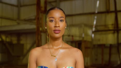 Epic-closeup-of-a-pretty-face-brown-skin-girl-at-an-abandoned-warehouse-in-the-Caribbean