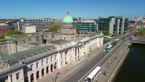 ascending aerial video of custom house quay in dublin, county leinster, ireland on a bright and sunny day. filmed in 4k, 60fps and with rec709 color.