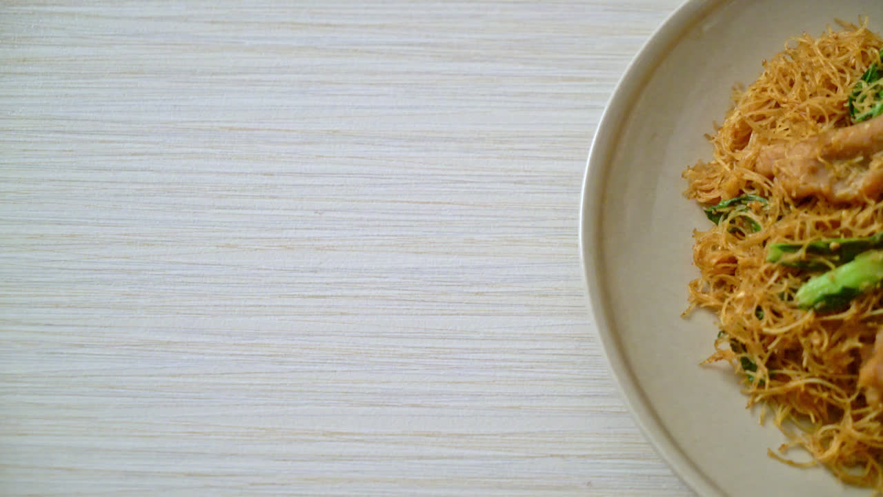 Stir fried rice vermicelli noodle with black soy sauce and pork - Asian food style