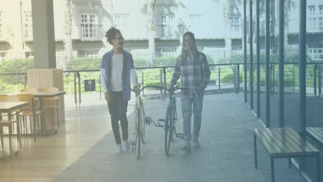 Spots-of-light-against-two-african-american-men-walking-with-their-bicycles-at-a-cafe