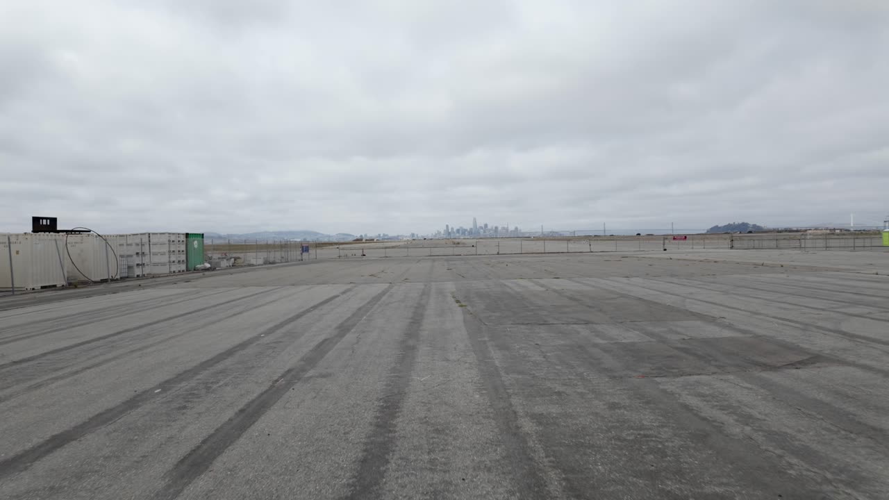 A dolly push in view of the land and warehouses of Alameda Point in Alameda California