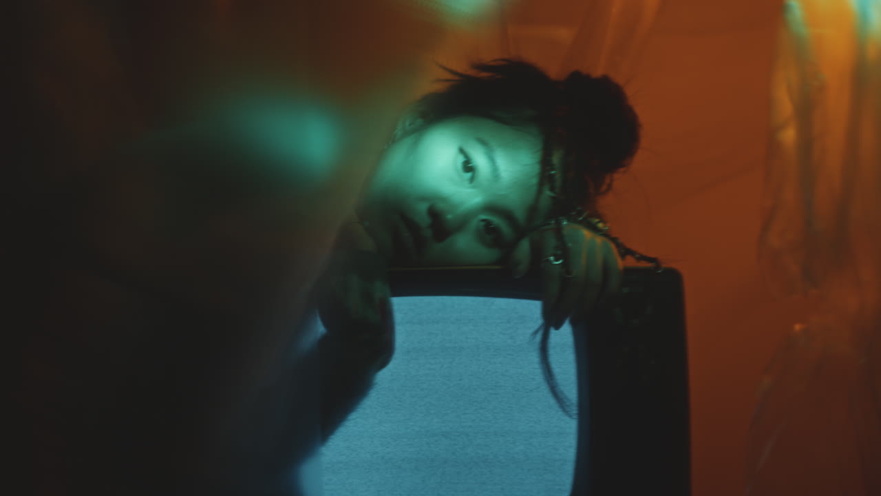 Portrait of Melancholic Girl Leaning on Retro TV with White Noise