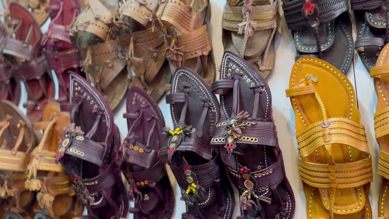 Panning shot of traditional Indian footwear known as Kolhapuri chappal