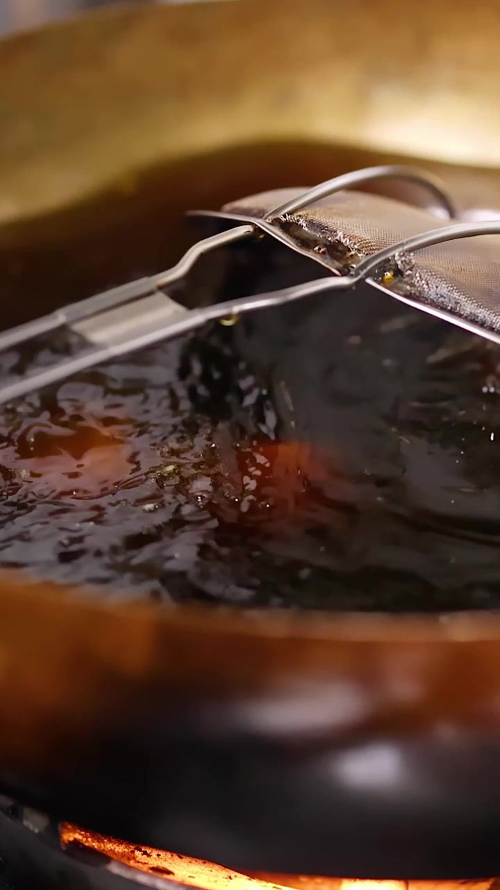 Deep Frying Samosas in Hot Oil in a Traditional Kitchen