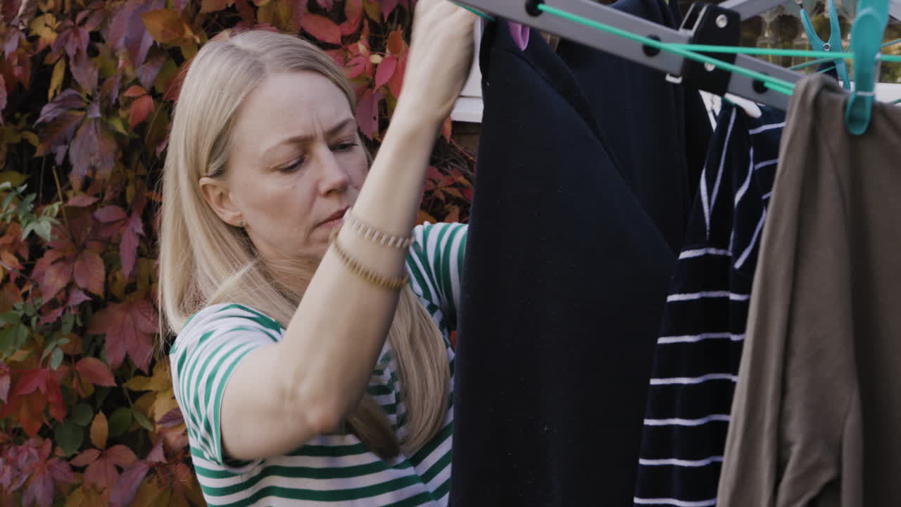 Woman Hanging Clothes to Dry