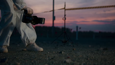 photographer in protective gear at sunset