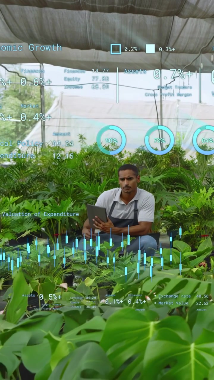 Vertical video: Nursery worker tapping tablet and opening finance HUD in nursery and checking sales