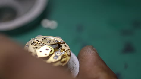 close-up-footage-of-a-craftsman-delicately-repairing-a-vintage-watch