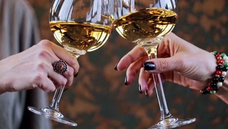 women toasting with white wine