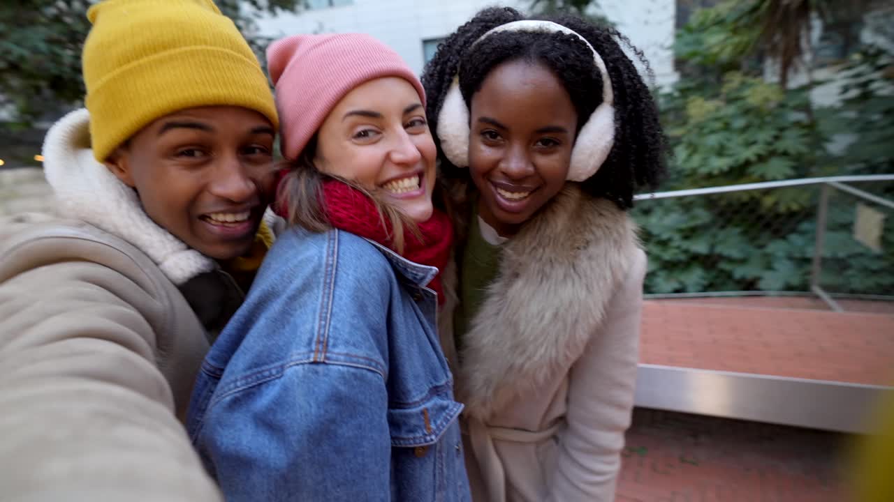 Three friends enjoying winter outdoors