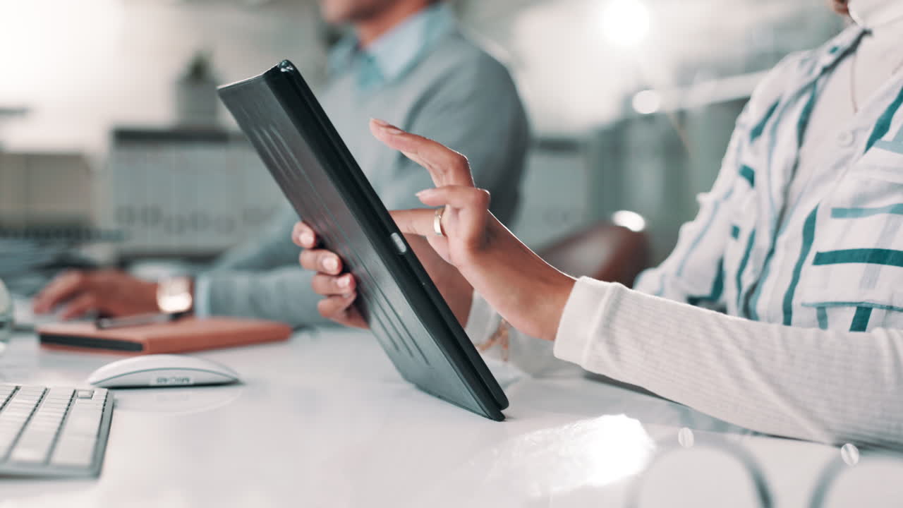 People working with a tablet in an office