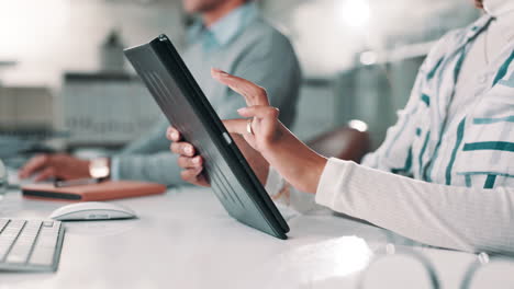 people working with a tablet in an office