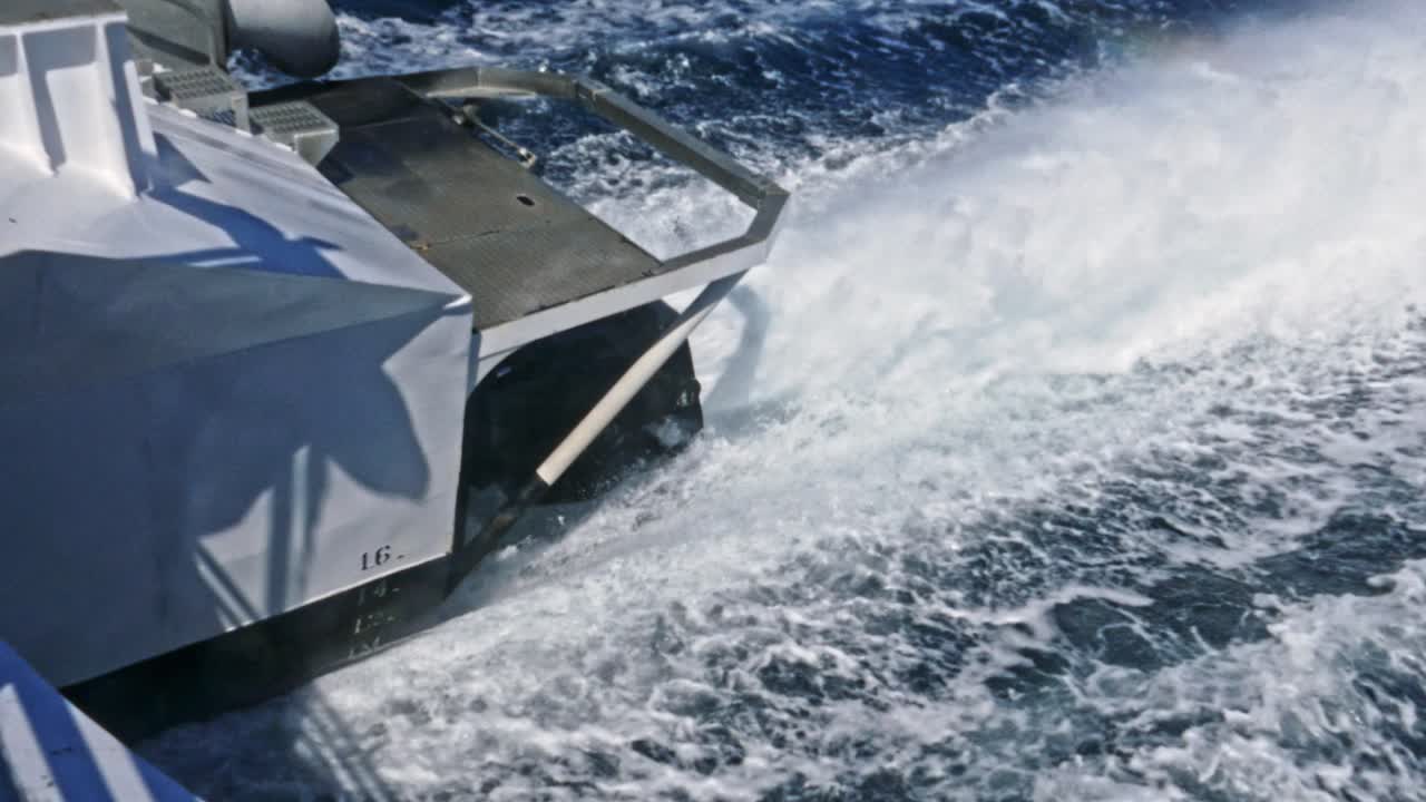 power of Jet engine closeup pushing passenger ferry through water