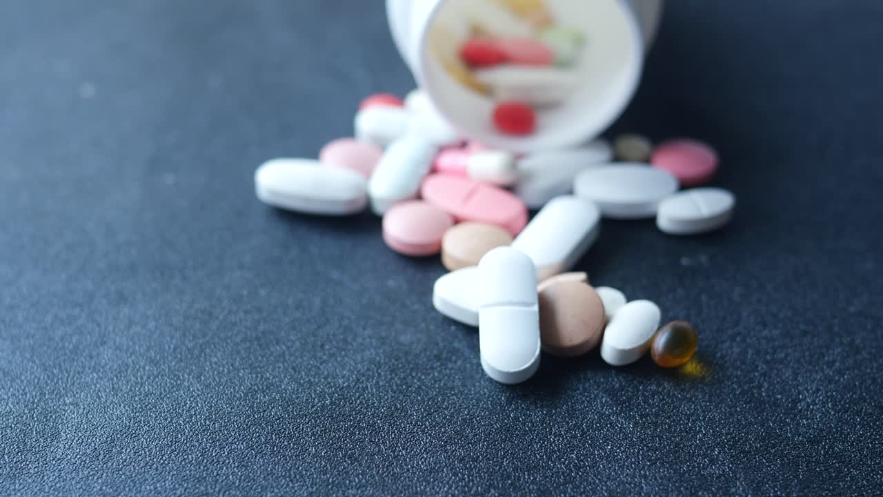 Selective focus close up of many ful pills and capsules